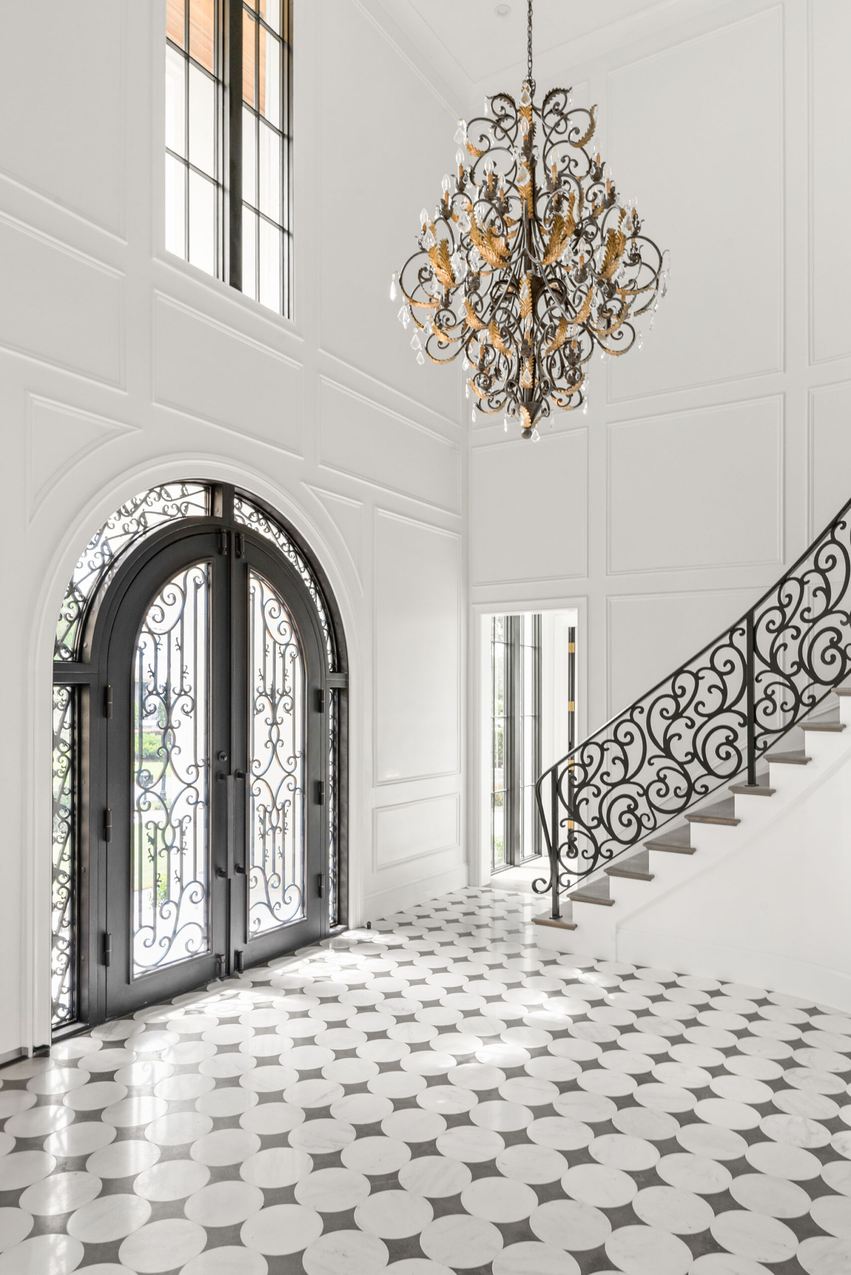 Luxury foyer with patterned tile flooring installation